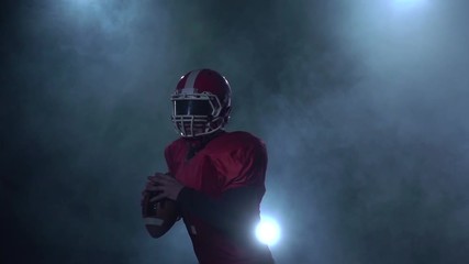 Throw rugby ball by player in red and white form - Powered by Adobe