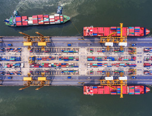 container ship in import export and business logistic.By crane , Trade Port , Shipping.Tugboat...