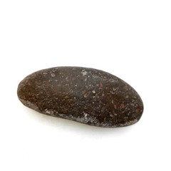 The round stone is isolated on a white background.