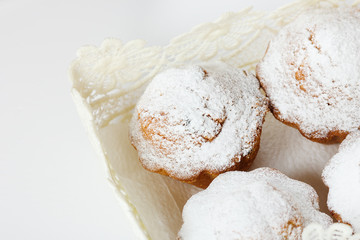 Muffins with icing sugar and raisins