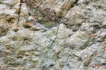 Rock texture and surface background. Cracked and weathered natural stone background.