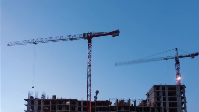 Crane works at construction site. Time Lapse video.