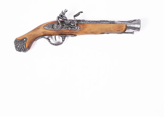 Old gun on white background