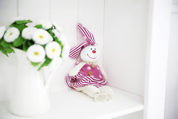 toy rabbit on a white shelf