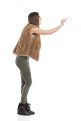 Woman In Brown Fur Waistcoat Writing, Side View