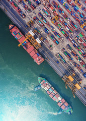 container ship in import export and business logistic.By crane ,Trade Port , Shipping.cargo to...