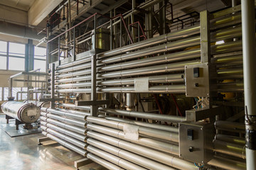 Special industrial equipment in the workshop of a factory for the production of wines and champagne