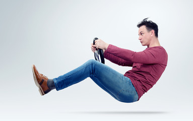 Serious man drives a car with a steering wheel © afxhome