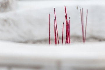 Burning red sticks for worship in buddhist temple.