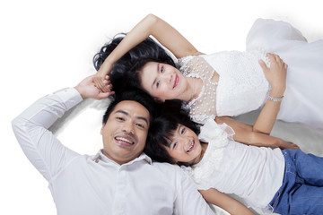 Asian family lying on the floor
