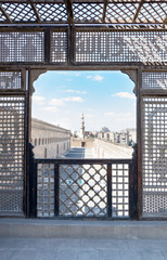Passage surrounding the Mosque of Ibn Tulun framed by interleaved wooden perforated wall (Mashrabiya), Medieval Cairo, Egypt