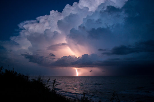 Strike of lightning from big beautiful cloud after storm © romanlv