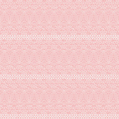 Seamless lace texture. White lacy small flowers on pink background.