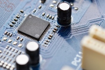 Components on board. PCB to PC. Chip, capacitor and connectors on the motherboard of a personal...