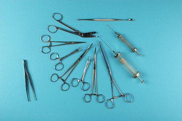 Surgical Instruments on blue background.