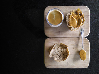 Cup of coffee and rye bread with peanut butter