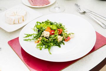 The salad with rucola and pine nuts