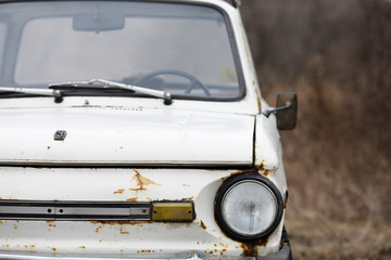 Old car white on a nature background