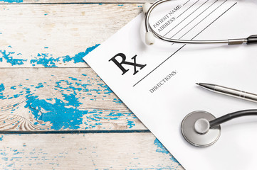Prescription form with stethoscope and pen. Medical concept.