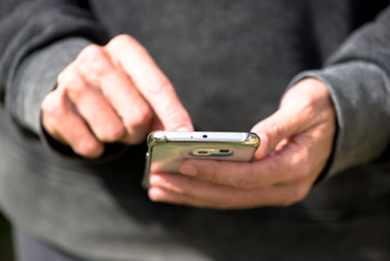 Fototapeta premium Man with mobile phone, touching the screen