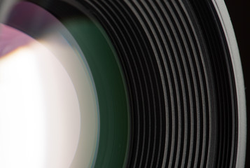 Camera lens close-up on black background