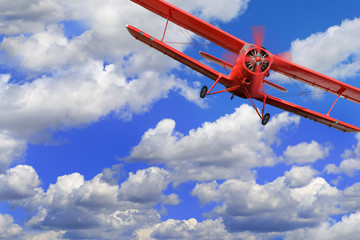 Red airplane biplane with piston engine