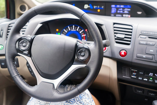 modern car leather stiring wheel with dashboard