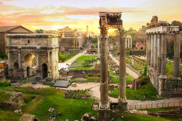 Fototapeta premium Ruins of Roman's forum at sunset, ancient government buildings started 7th century BC. Rome