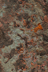 rusted metal with flaking blue paint