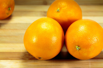 Close up fruit orange, isolated on a wood background.