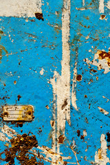 rusty metal with cracked flaky blue paint