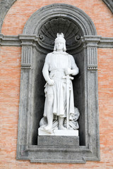 statue on facade of the Palazzo Reale