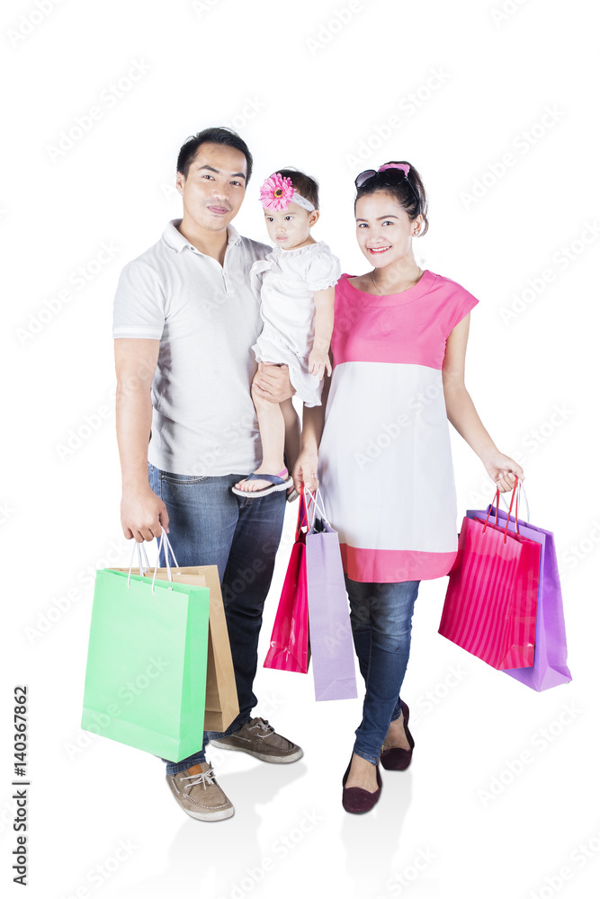 Wall mural Happy family shopping together