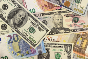Money background american dollars and euro different denominations.