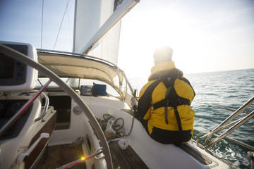 Relaxed Mature Man Sailing On Yacht