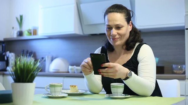 Woman browsing internet on smartphone and talking to herself
