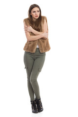 Frozen Woman Hugging Self And Grimacing