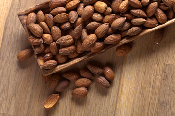 Almonds in old wooden dish