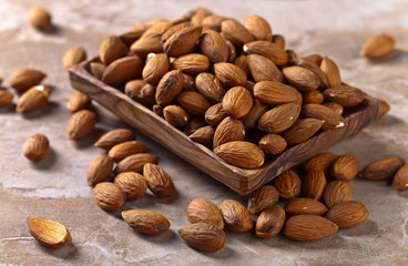 Almonds in old wooden dish