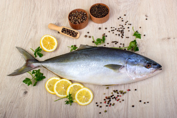 Fish with lemon, pepper and greens.