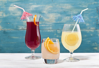 Various cocktail glasses are together.