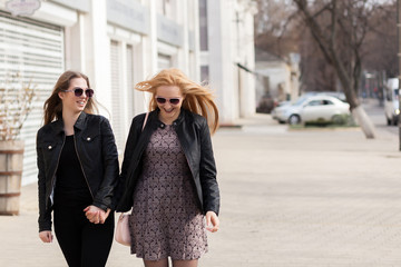 Two girl friends having fun in the city