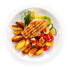Grilled chicken fillet, chips and vegetable salad 
