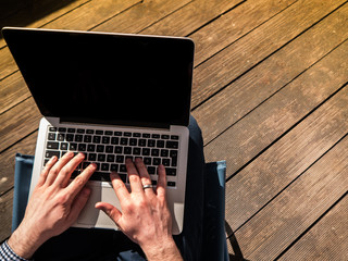Fototapeta premium Home Office: Young man working with his laptop