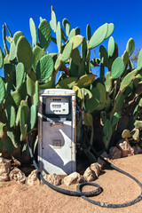 Old dirty gas station petrol pump in the desert.