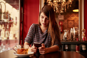 Pretty young lady in a bar