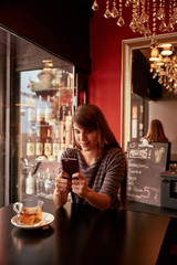 Focused young lady in a pub