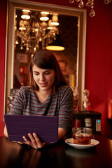 Lovely young lady in a pub