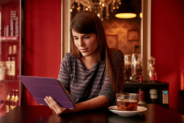 Beautiful young woman in a pub