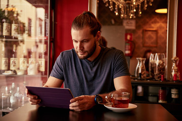 Handsome young man in a pub